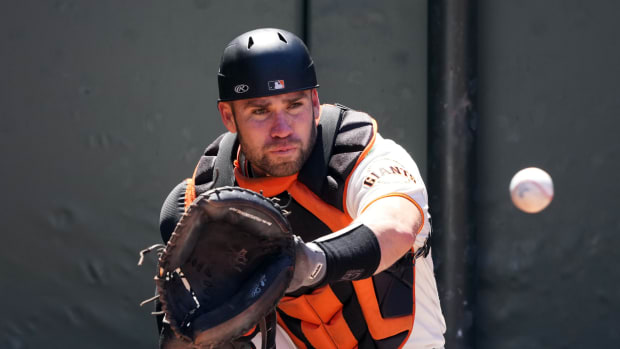 Austin Wynns catches and waits for another NL West opportunity. (2023)
